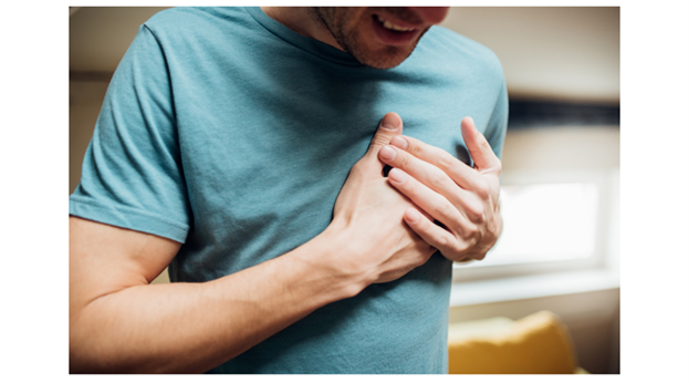 Man experiencing symptoms of a heart attack